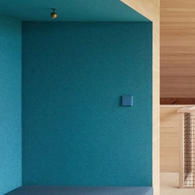 JUNG LS990 light switch in cerulean blue on blue wall