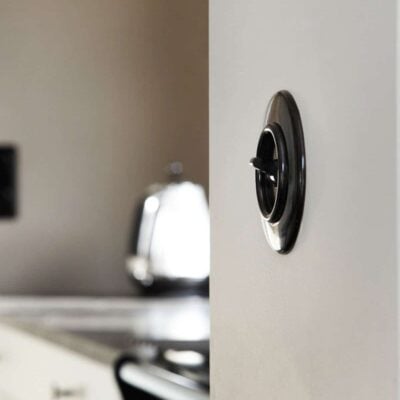 THPG Bakelite toggle light switch on kitchen wall