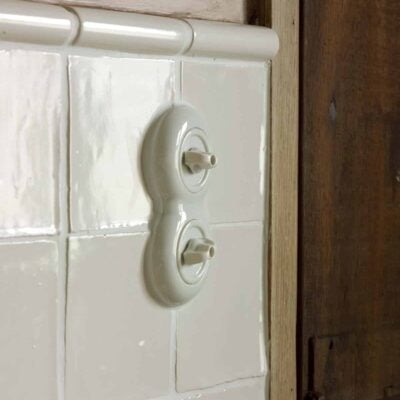 THPG Porcelain Rotary light switch on tiled wall